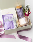 self-care gift box with candle, tumbler, and skincare items — foxblossom