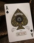 Playing card with 'Artisan Black Edition' design on a textured background