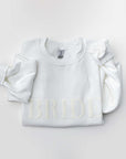 Folded white sweatshirt with “BRIDE” embroidered in white thread across the chest, displayed on a white background.