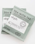 Calming Tea Sachets, in light green sachet with black letters.
