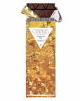 A close-up photograph showcases a partially unwrapped Compartes Champagne Bar, highlighting its packaging design and dark chocolate.
The image is a product shot, with the chocolate bar positioned centrally against a white background, suggesting a studio setup. The top portion of the bar is unwrapped, revealing the dark chocolate's triangular pieces. The packaging extends below, with a prominent design featuring golden champagne glasses and shimmering effects, suggesting a celebratory theme.