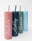 Our custom tumblers with straw shown in the four colors they come light blue, navy, green and rose. Personalized in white lettering with the names Valerie, Ashley, Jasmine and Natalie on a white background.