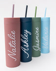 Our custom tumblers with straw shown in the four colors they come light blue, navy, green and rose. Personalized in white lettering with the names Valerie, Ashley, Jasmine and Natalie on a white background.