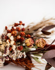 Dried floral bundle close-up image in a white background.