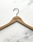 Engraved bride hanger, is featured with Samantha bridesmaid on a marble like background.