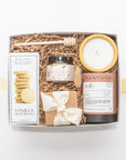 Relaxing gift box with vanilla shortbread cookies, raw clover honey, handpoured candle, small batch tea, sea salt caramels, and a honey drizzler. Appreciation gifts, housewarming gifts, anniversary gifts.