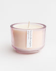 Lavender and Eucalyptus luxury candle is featured in its pink glass container on a white background.