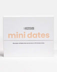 Mini Dates is a white box, likely made of cardboard or similar material, split horizontally into two sections. On the top section, it features the words "THE ADVENTURE CHALLENGE" in small, dark letters at the top, and below, the phrase "mini dates" in a large, soft coral color font, which dominates the visual space. The bottom section includes the text "30 scratch-off dates that can be done in 30 minutes or less." in a smaller, dark font.