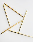 Five minimalist gold pens are featured on a white background.
