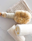 Nordic dry brush featured in a spa setting image in a marble like image.