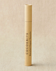 Beige cylindrical container with 'COCKKNITS' branding on a beige background