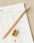 Pencil and sharpener on a worksheet with 'Cocoonits' branding.