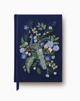 Blue notebook with embroidered peacock.