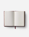Open notebook with blank pages on a white background