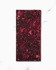Image of the apres chocolate bar from ritual opened, a dark chocolate with raspberries.
