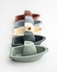 set of five stacking bath boats in various colors on a white background.