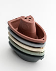 set of five stacking bath boats in various colors on a white background.