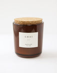 8 oz chai scented soy candle, approx 3.25" x 3.75", brown glass container with cork lid and white sticker.