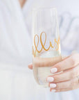 Personalized Champagne Flute, stemless, a bride holding one with gold lettering with the name Allison.