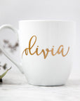 White mug with gold script name