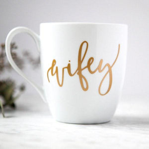 White ceramic mug, 15 oz , "wifey" in gold script font