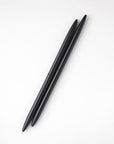 Two minimalist black pens are featured on a white background.