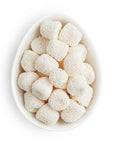 Sugrafina Champagne Bubbles, Small white oval dish containing white gummy drops covered in white nonpareils.