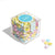 sugarfina plastic cube filled with colorful candy coated chocolate pieces