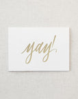 White greeting card with gold foil "Yay!"