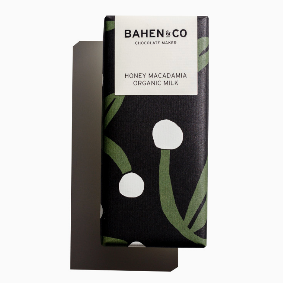 Bahen &amp; Co Honey Macadamia Organic Milk Chocolate bar — 75 g artisan stone-ground milk chocolate with slow-roasted macadamias and drizzled honey, in a rectangular wrapper.