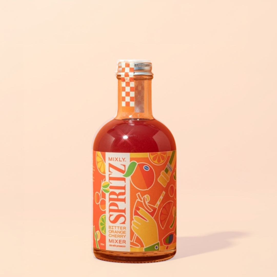 Bottle of Mixly Spritz bitter orange cherry mixer on a beige background