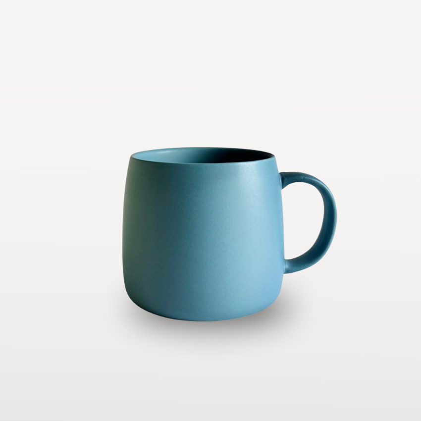 Blue mug on a light gray background