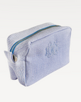 Blue and white striped rectangular makeup bag with zipper closure.