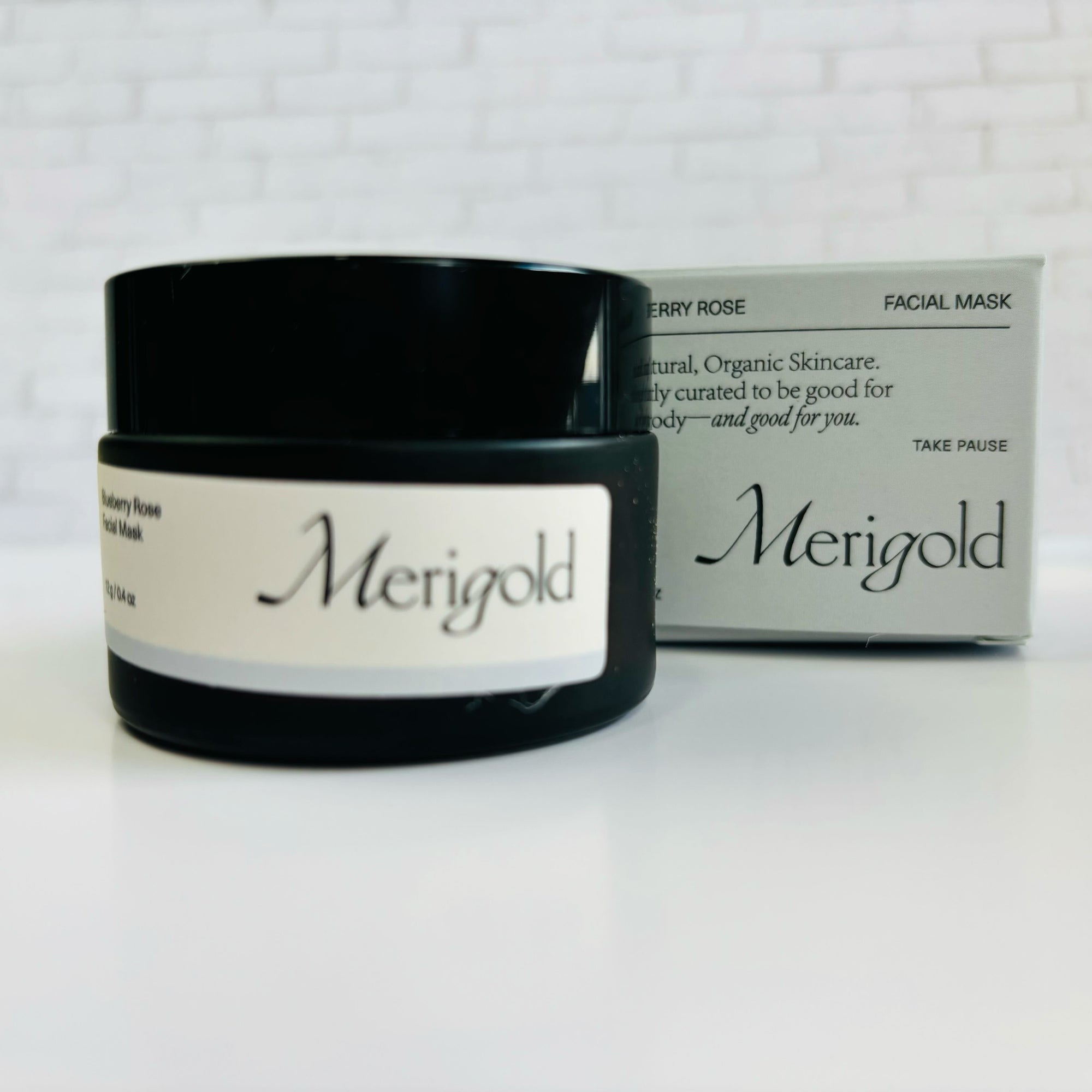 Merigold blueberry facial mask in a black jar  closed and blue box. 