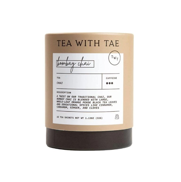 Bombay chai tea large its featured in its light brown cylindrical container with black bottom with white label with black lettering on a white background. 