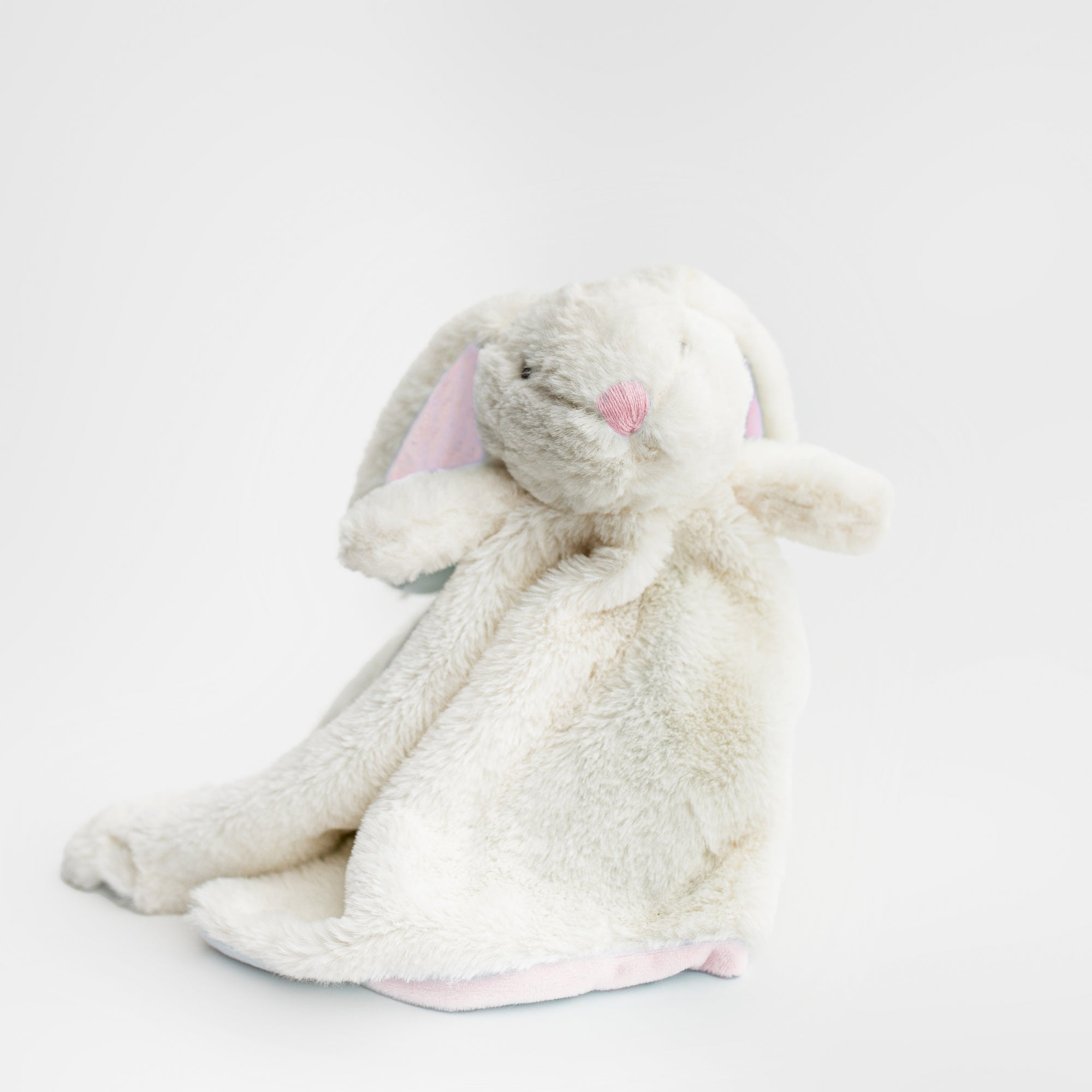 Bunny lovey snuggler is featured the bunny in white with pink details on a white background. 