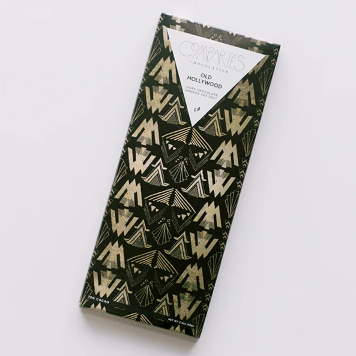 Compartés Old Hollywood chocolate bar shown in its black wrapper with green and gold geometric shapes, featuring a white triangular label with black lettering, displayed on a white background.