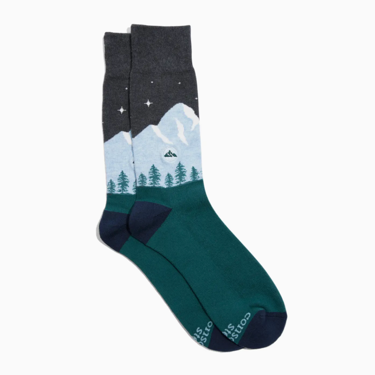 Sock with mountain and tree design on a white background