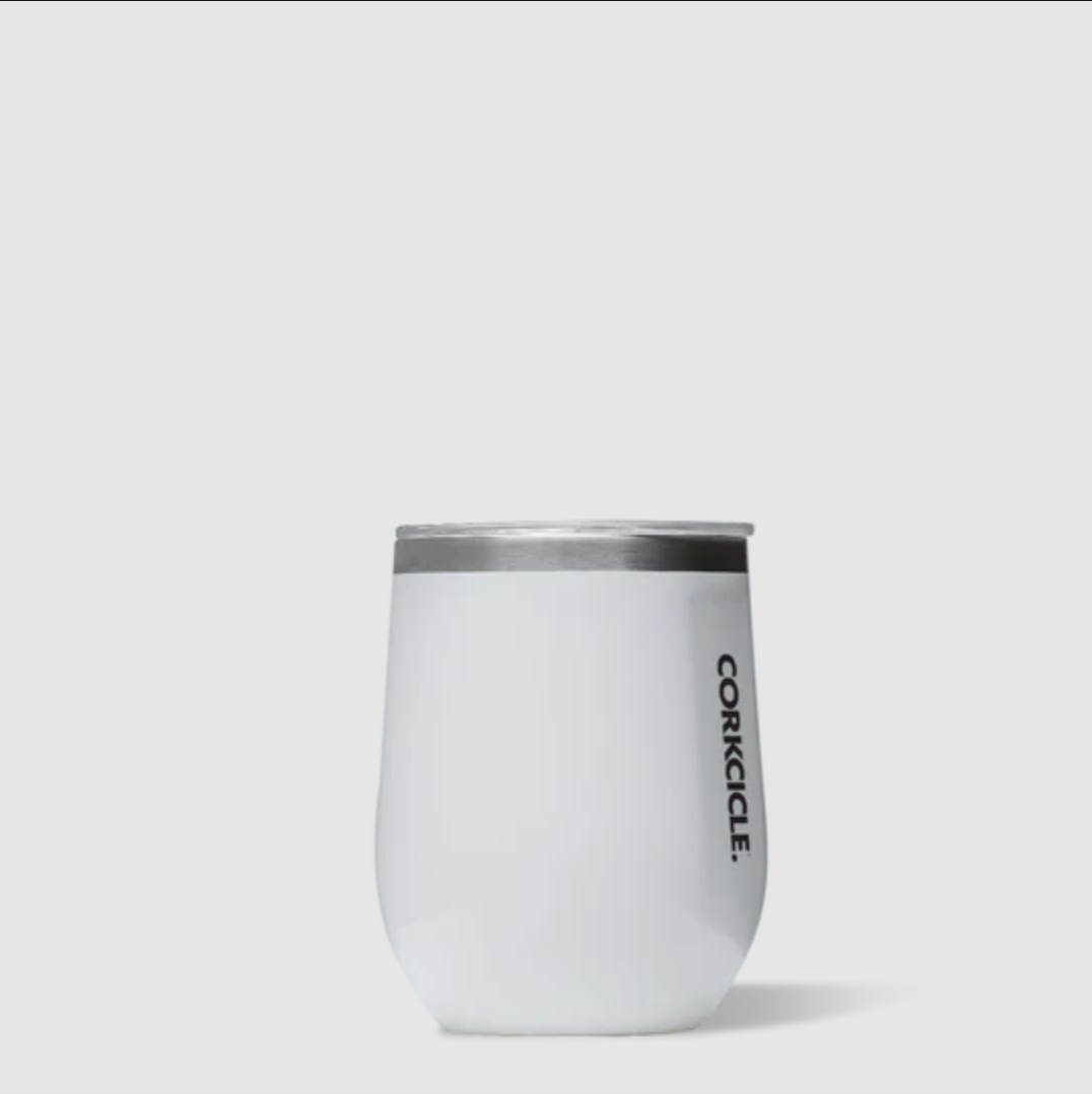 Corkcicle white tumbler , silver rim and transparent lid with the brand name corkcicle in black lettering.