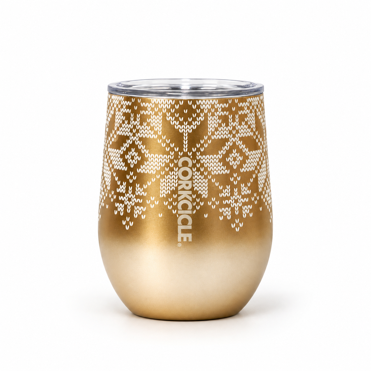 A gold-colored stemless wine tumbler with a white knit-patterned snowflake design and a clear lid, shown on a white background.