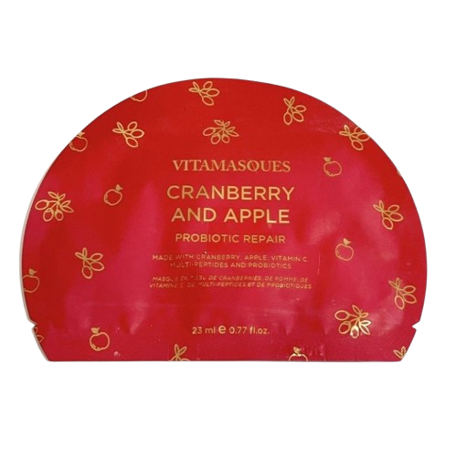 Cranberry and apple mask is featured in its red package with gold lettering and details on a white background. 