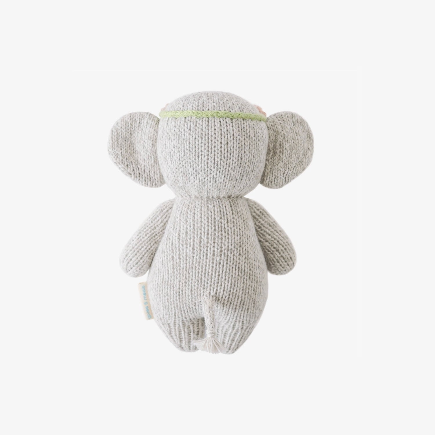 Back of handcrafted Cuddle + Kind Baby Elephant plush in soft grey knit fabric, sitting upright on a clean white background, featuring large floppy ears, stitched facial details, and a cozy handmade texture.