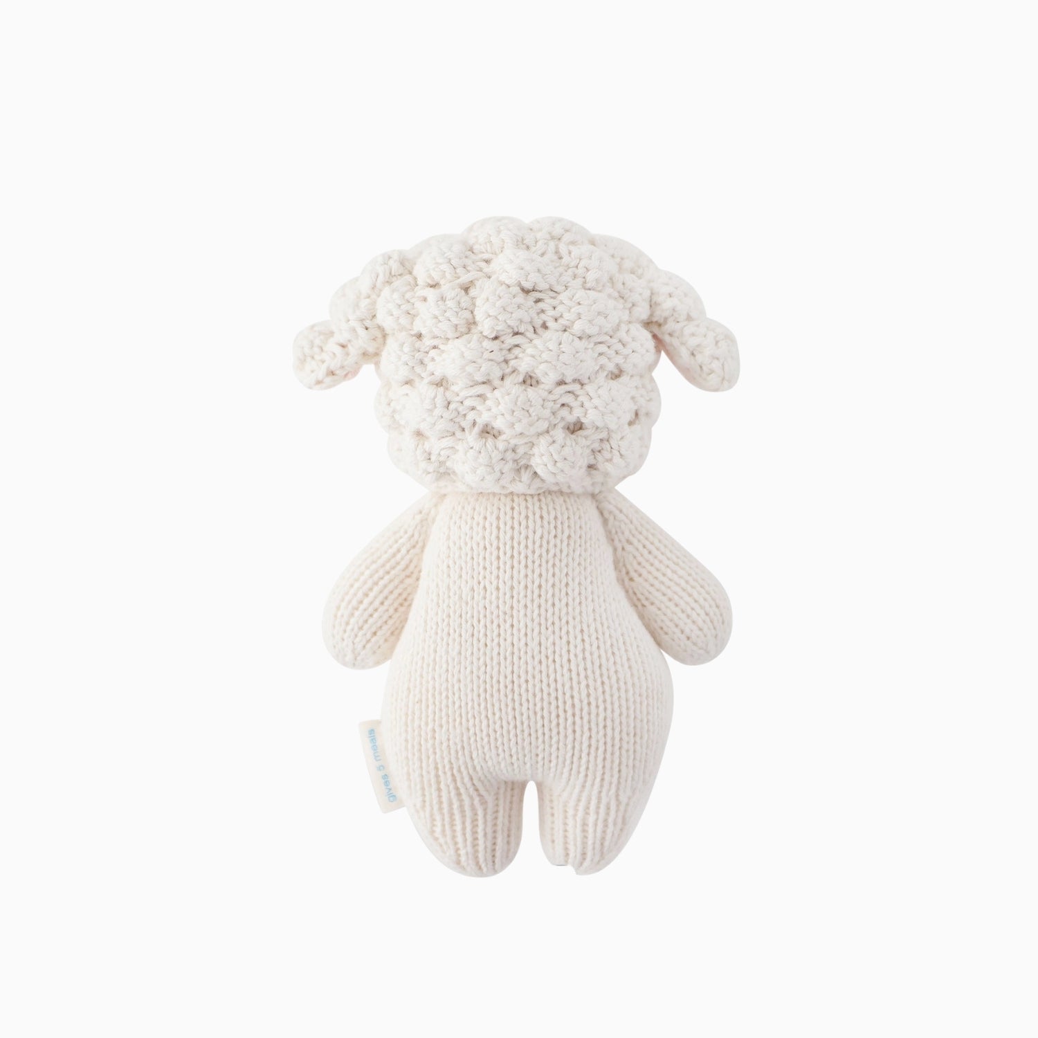 The back of Cuddle + Kind baby lamb on a white background. 