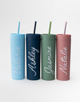 Our custom tumblers with straw shown in the four colors they come light blue, navy, green and rose. Personalized in white lettering with the names Valerie, Ashley, Jasmine and Natalie on a white background.  