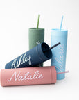 Our custom tumblers with straw shown in the four colors they come light blue, navy, green and rose. Personalized in white lettering with the names Valerie, Ashley, Jasmine and Natalie on a white background.  
