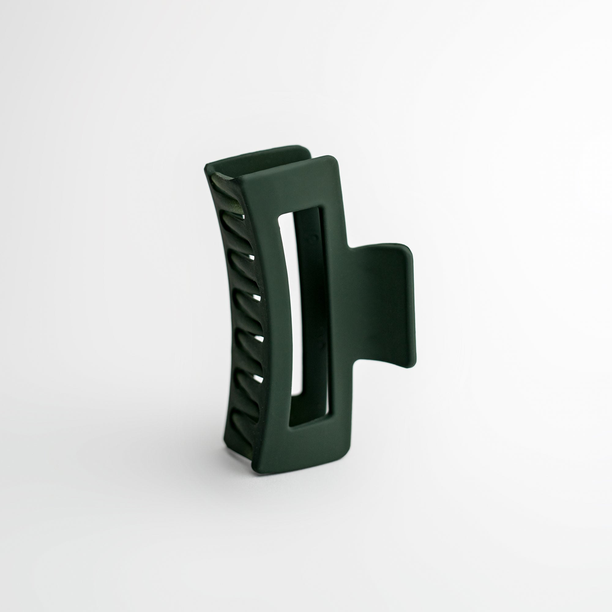 Dark sage - hunter green hair claw on a white background.