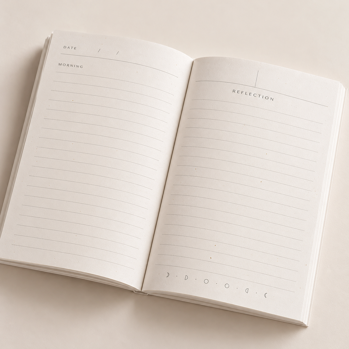 An open lined journal with blank pages, showing a left page labeled 'DATE' and 'WORKING' and a right page labeled 'REFLECTION', photographed on a light beige background.