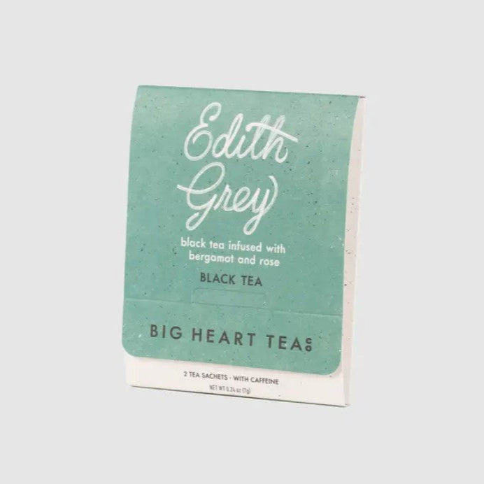 Edith grey black tea is featured in its container in rectangular light greeen package with white and black lettering on a white background.