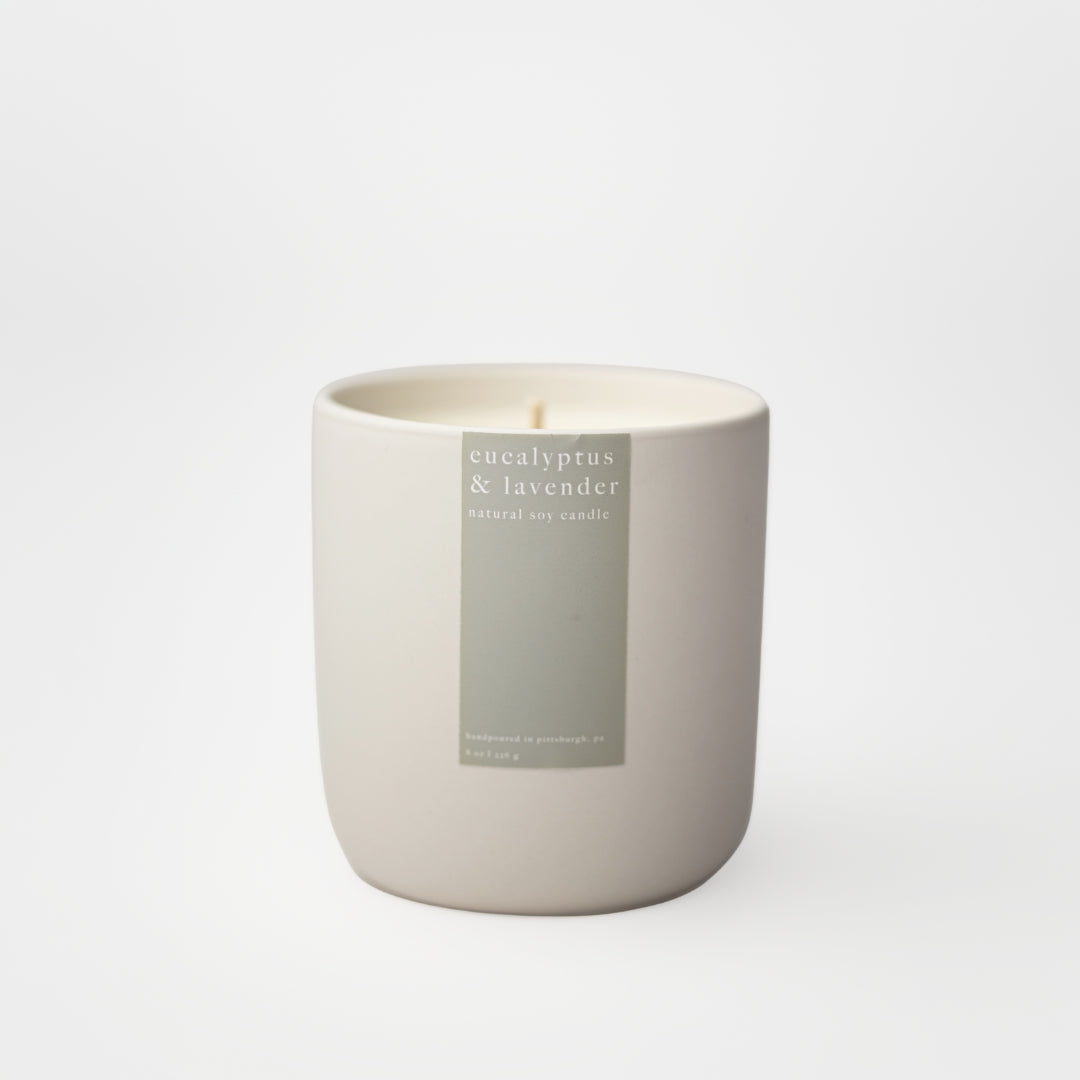 Candle with a label on a white background