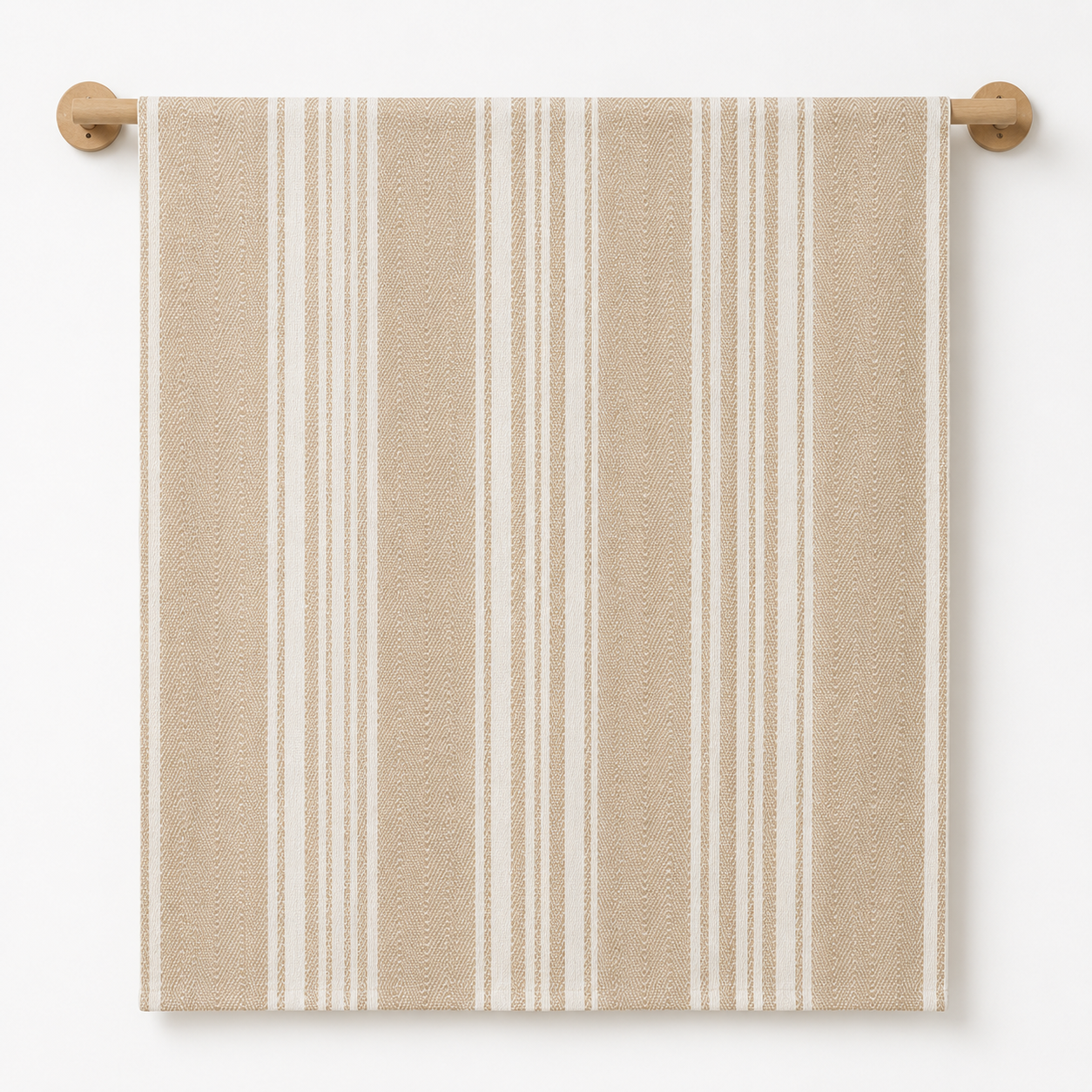 White towel with beige stripes hanging on a wooden towel rack against a white wall.
